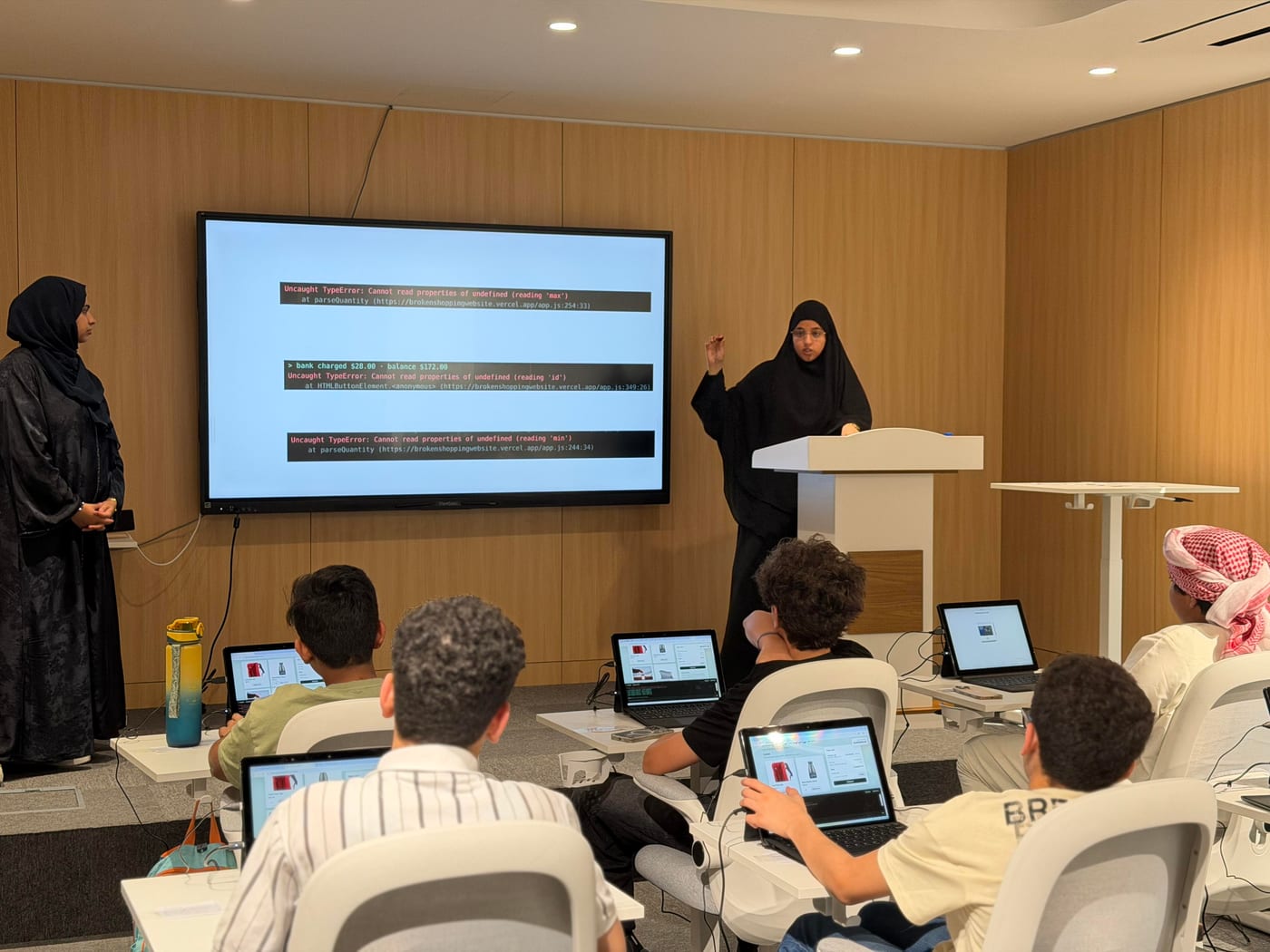 A student presenting their work to the class